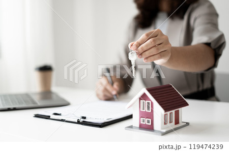 agents working in real estate investment and home insurance signing contracts in accordance with the home buying insurance agreements approving purchases for clients agents working in real estate investment and home insurance signing contracts in accordance with the home buying insurance agreements approving purchases for clients 119474239