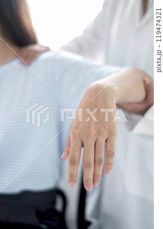 Female physiotherapists provide physical assistance to women patients with elbow injuries examine patients in rehabilitation centers. Physiotherapy concepts 119474321