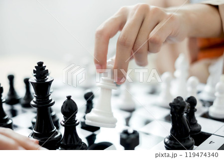 hand of business moving chess in competition shows leadership, followers and business success strategies hand of business moving chess in competition shows leadership, followers and business success strategies 119474340