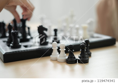 hand of business moving chess in competition shows leadership, followers and business success strategies 119474341