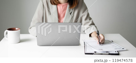 Business woman employer holding resume hiring recruit looking cv resume to hire candidates, analyzing information before job interview. Recruitment concepts 119474578