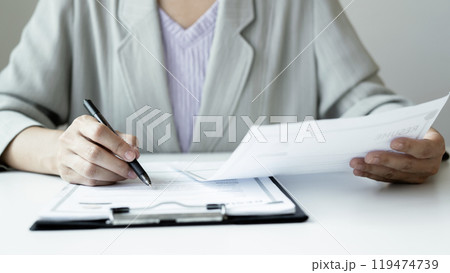 Business woman employer holding resume hiring recruit looking cv resume to hire candidates, analyzing information before job interview. Recruitment concepts Business woman employer holding resume hiring recruit looking cv resume to hire candidates, analyzing information before job interview. Recruitment concepts 119474739