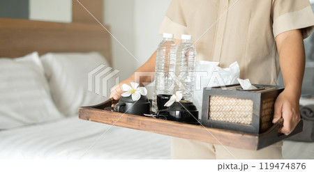 The housekeeper hotel cleans and arranges things in order. prepares to welcome VIP guests The housekeeper hotel cleans and arranges things in order. prepares to welcome VIP guests 119474876