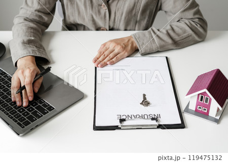 agents working in real estate investment and home insurance signing contracts in accordance with the home buying insurance agreements approving purchases for clients agents working in real estate investment and home insurance signing contracts in accordance with the home buying insurance agreements approving purchases for clients 119475132