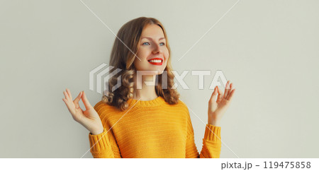 Calm relaxed healthy young woman meditates, girl practicing doing yoga exercises, stress relief Calm relaxed healthy young woman meditates, girl practicing doing yoga exercises, stress relief 119475858