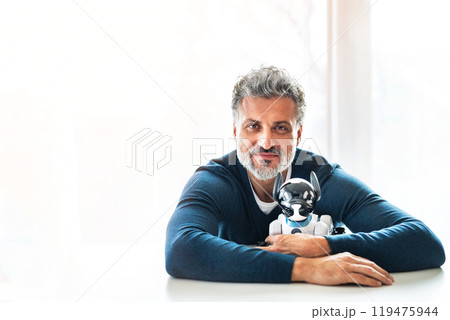 The man with his adorable robotic dog. 119475944