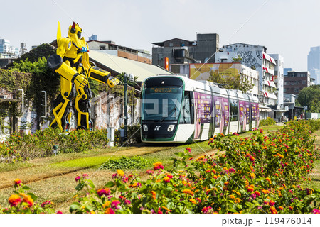 The circular light rail train drives past Pier-2 Art Center in Kaohsiung, Taiwan. 119476014