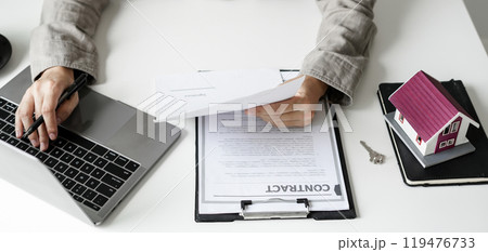 agents working in real estate investment and home insurance signing contracts in accordance with the home buying insurance agreements approving purchases for clients agents working in real estate investment and home insurance signing contracts in accordance with the home buying insurance agreements approving purchases for clients 119476733