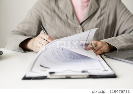 Business woman employer holding resume hiring recruit looking cv resume to hire candidates, analyzing information before job interview. Recruitment concepts Business woman employer holding resume hiring recruit looking cv resume to hire candidates, analyzing information before job interview. Recruitment concepts 119476738