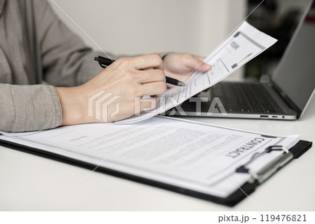 Business woman employer holding resume hiring recruit looking cv resume to hire candidates, analyzing information before job interview. Recruitment concepts 119476821