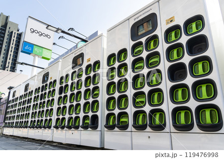 Taiwanese Gogoro electric vehicle company's swappable batteries and charging infrastructure. Batteries charging station for scooter bike motorcycles. Taiwanese Gogoro electric vehicle company's swappable batteries and charging infrastructure. Batteries charging station for scooter bike motorcycles. 119476998