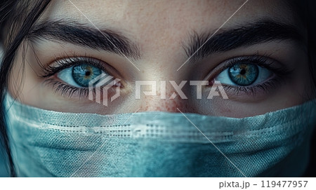 A close-up of a woman's eyes above a medical mask, representing the impact of viruses and the struggle for health. Generated AI. 119477957
