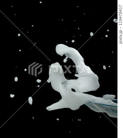 White bubble foam fly in many shape form and splashing in air. Bubble foam use to clean wash toilet kitchen bathroom. Black background isolated, texture element object 119478417