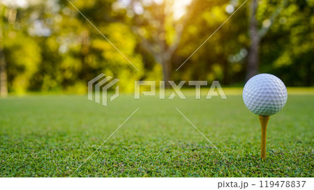 golf ball on tee in beautiful golf course with sunset. golf ball on tee in beautiful golf course with sunset. 119478837