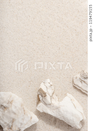 Natural cosmetic background for product presentation. White rocks on the sand. Top view. Natural cosmetic background for product presentation. White rocks on the sand. Top view. 119479155