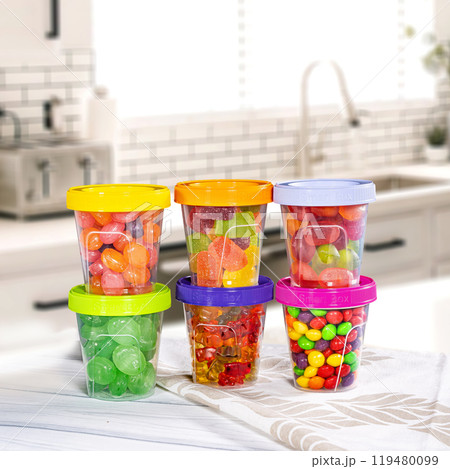Plastic container set of six for drink food and foodstuffs with plastic cover. Colorful covers on long plastic container cup. Plastic container set of six for drink food and foodstuffs with plastic cover. Colorful covers on long plastic container cup. 119480099