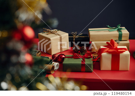 Celebrating Holiday Season with Wrapped Gifts Celebrating Holiday Season with Wrapped Gifts 119480154