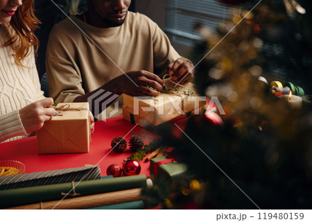 Wrapping Gifts Together During Holiday Season Celebration 119480159