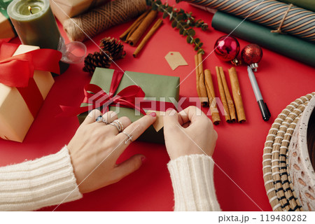Wrapping Holiday Gifts with Festive Decorations Wrapping Holiday Gifts with Festive Decorations 119480282