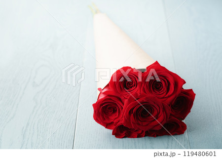red roses bouquet on blue wood table red roses bouquet on blue wood table 119480601