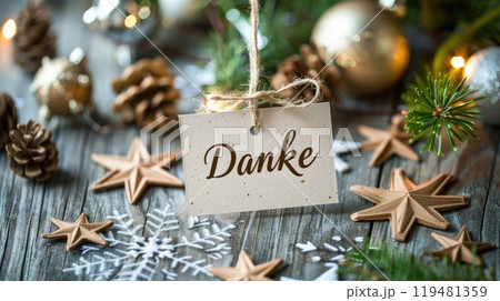 paper tag with german word thank you on christmas background 119481359