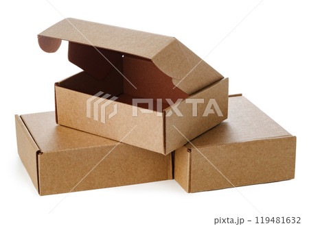 Stacked brown cardboard boxes in various sizes arranged on a white background Stacked brown cardboard boxes in various sizes arranged on a white background 119481632
