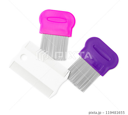 Colorful plastic and metal combs on a white background 119481655