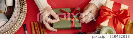 Preparing Festive Gifts with Decorative Ribbon Preparing Festive Gifts with Decorative Ribbon 119482018