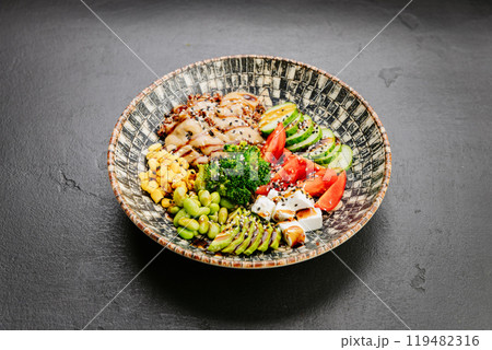 Colorful Buddha bowl with fresh vegetables, quinoa, and avocado, healthy eating and wellness lovers Colorful Buddha bowl with fresh vegetables, quinoa, and avocado, healthy eating and wellness lovers 119482316