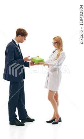 Female doctor offering box with special health products to businessman, isolated on white background 119482904