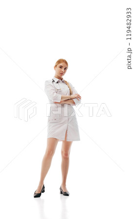 Confident female doctor standing with arms crossed isolated on white background Confident female doctor standing with arms crossed isolated on white background 119482933
