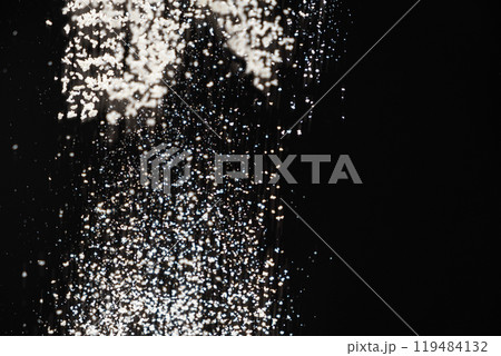 Abstract black and white background of pouring flour, space for text Abstract black and white background of pouring flour, space for text 119484132