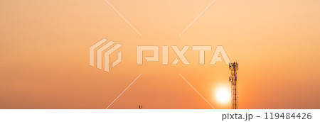 Telecommunication tower with antenna at sunset. Infrastructure of modern communication technology. 5G network connectivity and the global telecommunications industry. Wireless communication industry. 119484426