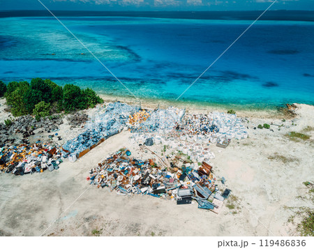 Rubbish dump with recycling and ocean in Maldives. Ecological problem. Drone view Rubbish dump with recycling and ocean in Maldives. Ecological problem. Drone view 119486836