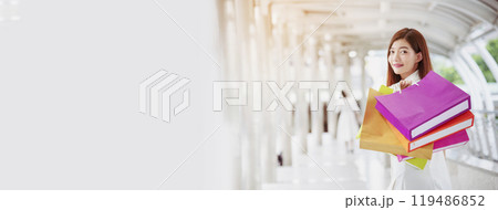 Banner Shopping bags of women crazy shopaholic person at fashion mall. Web Banner Woman love online shopping website holding shopping bags in hands with copy space. digital marketing happy lifestyle Banner Shopping bags of women crazy shopaholic person at fashion mall. Web Banner Woman love online shopping website holding shopping bags in hands with copy space. digital marketing happy lifestyle 119486852