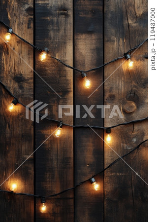 Warm string lights hanging against a rustic wooden wall create a cozy atmosphere at night Warm string lights hanging against a rustic wooden wall create a cozy atmosphere at night 119487000