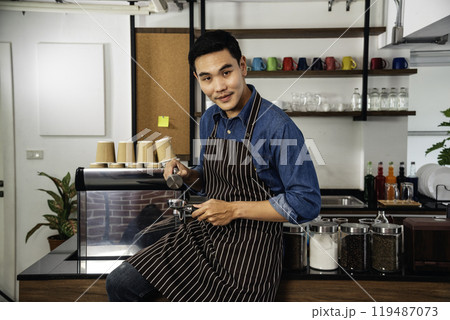 Portrait barista Asian man coffee shop owner smiling look at camera small business confident person Entrepreneur manager professional men standing coffee counter bar. Barista small business Owner 119487073