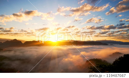 Scenic view dramatic beautiful sunset sky. Natural Sunset Sunrise on meadow silhouette shadow dark land. Vibrant dramatic sky on sunset, dawn, sunrise in Countryside. Landscape Colorful Sky At Sunset 119487087