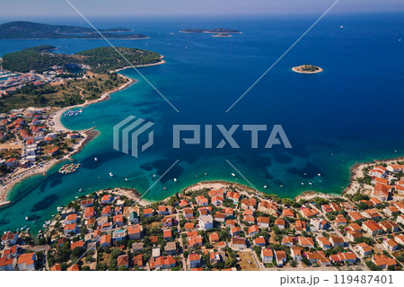 Aerial view of Adriatic sea coastline with coastal village and boats along shoreline. Panorama of tourist town Rogoznica in Croatia on Adriatic Sea. Summer travel concept 119487401