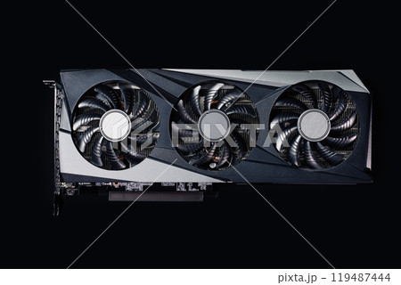 Close-up of high-performance graphics card with three cooling fans on dark background. Modern video card for gaming and advanced computing 119487444
