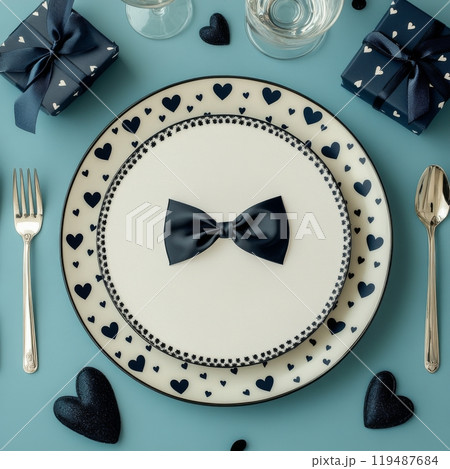 Elegant table setting with heart themed decor for a romantic dinner on a blue background 119487684