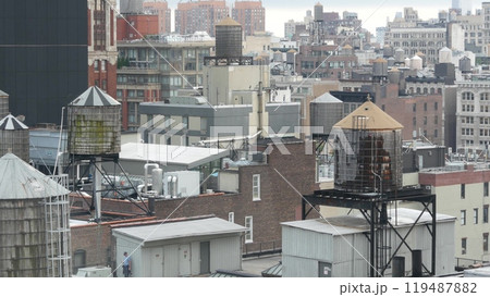 New York City Manhattan cityscape. Rooftop water towers, residential district buildings roof tanks. 119487882