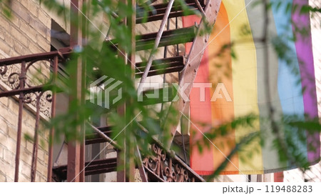 New York City building Manhattan USA. Residential house. LGBT rainbow flag, homosexual symbol. Pride New York City building Manhattan USA. Residential house. LGBT rainbow flag, homosexual symbol. Pride 119488283