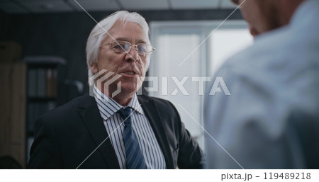 Angry boss loses temper, yells at male company employee Angry boss loses temper, yells at male company employee 119489218