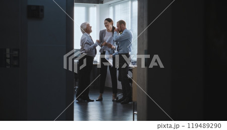 Happy team leader and company employees celebrate successful business deal 119489290