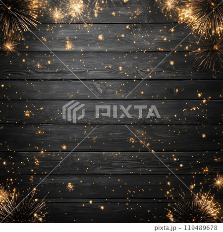 Sparks flying across a wooden surface during a celebration at night with a dark background 119489678
