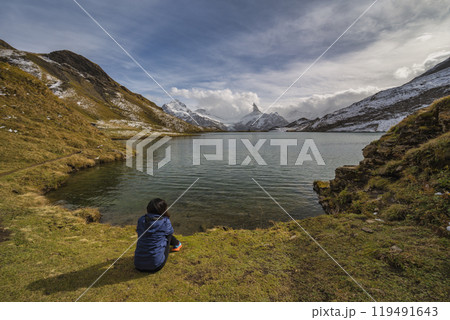 Grindelwald First Switzerland nature landscape at Bachalpsee Lake (Bachsee) with woman tourist 119491643