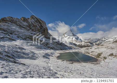 Zermatt Switzerland nature landscape at Matterhorn mountain peak and Riffelsee lake in winter season 119491701