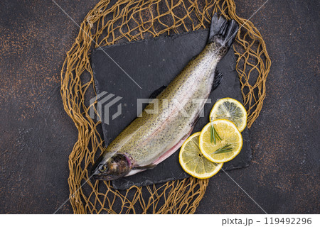 Raw uncooked trout with lemon 119492296