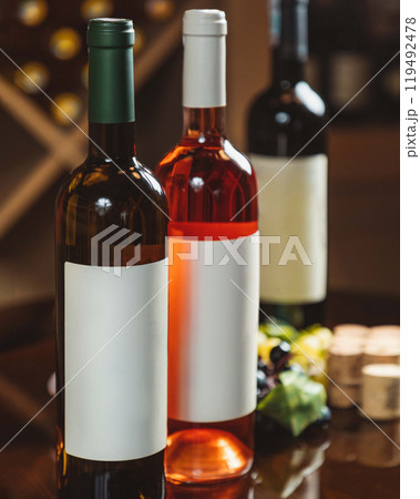Wine bottles standing with blank labels for your brand Wine bottles standing with blank labels for your brand 119492478
